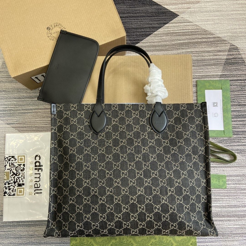 G*u*i shopping bags